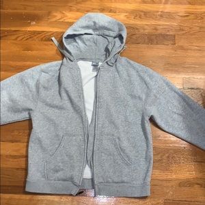 Light grey champion zip up hoodie.